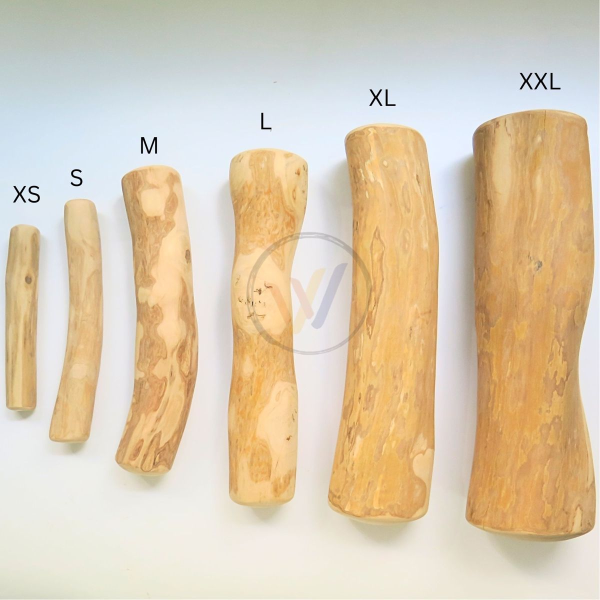 Coffee wood dog chew sizes XS, S, M, L, XL and XXL laid side by side